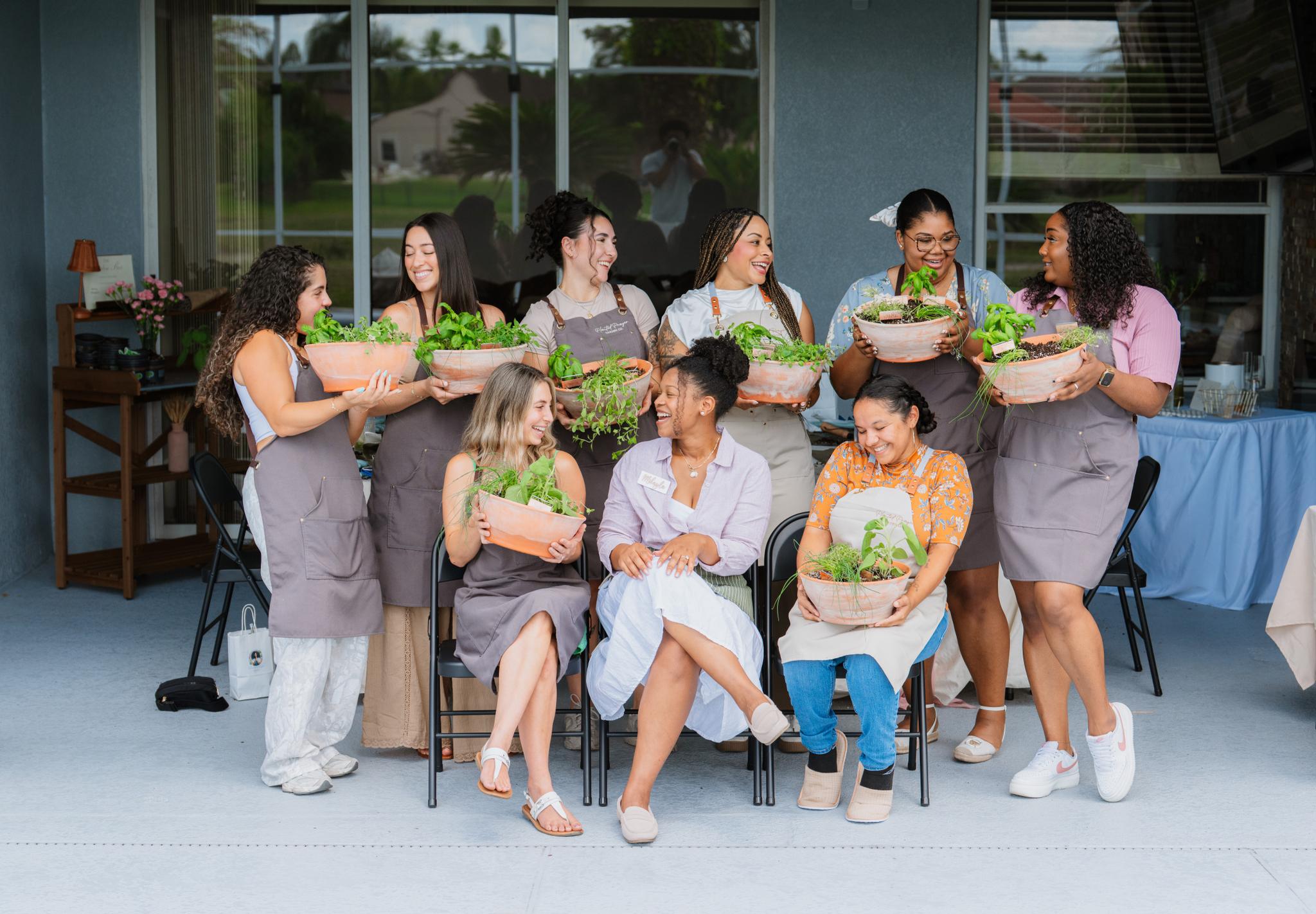 Brides gathered together holding their keepsake planters